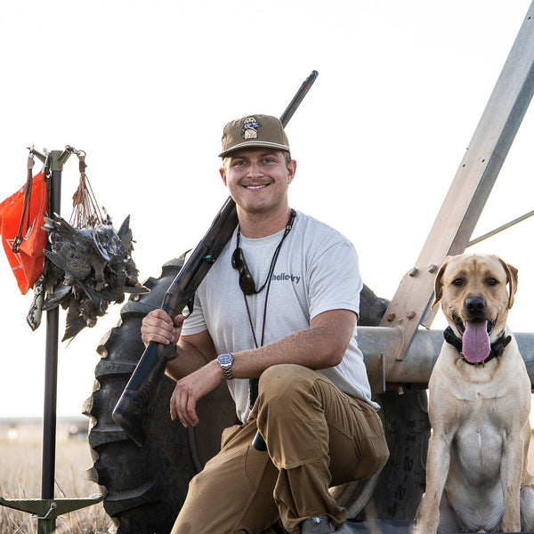 Delta Feather Man's Best Friend yellow lab rope hat with a mallard in his mouth — alternate view