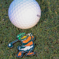 Delta Feather Duck Hook ball marker with a mallard duck golfing in hard enamel, on the green beside a golf ball