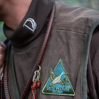 Close-up of the Coffee Bean Rendezvous Turtleneck collar with Delta Feather logo