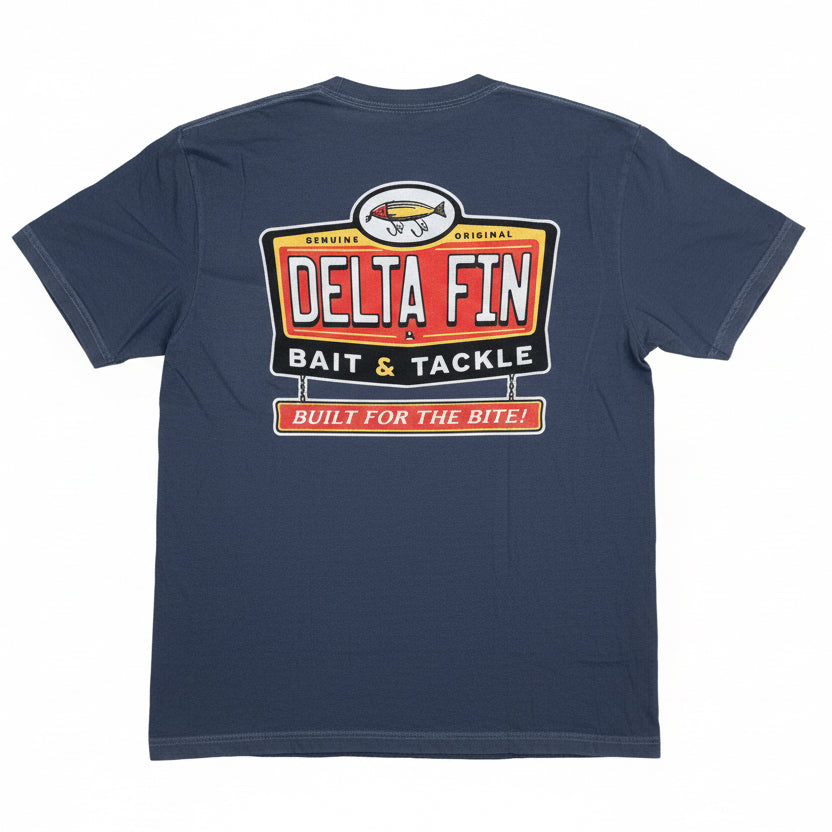 Navy blue t-shirt with a Delta Fin Bait & Tackle logo on a wooden floor.