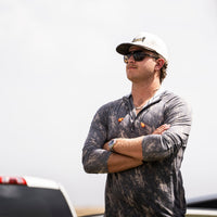 Delta Feather Gathering 1/4 zip hoodie in Quercus camo — lifestyle shot