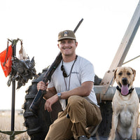 Delta Feather Man's Best Friend yellow lab rope hat with a mallard in his mouth — alternate view