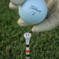 Duck Hook tee and golf ball detail