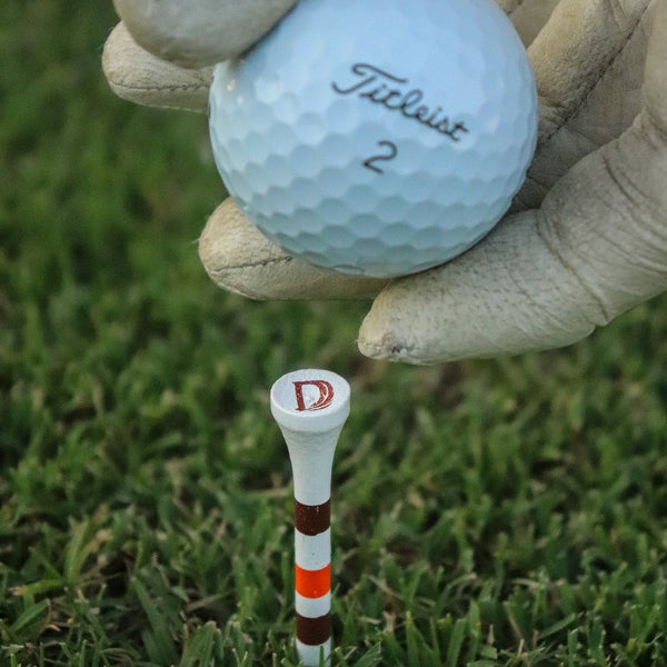 Duck Hook tee and golf ball detail